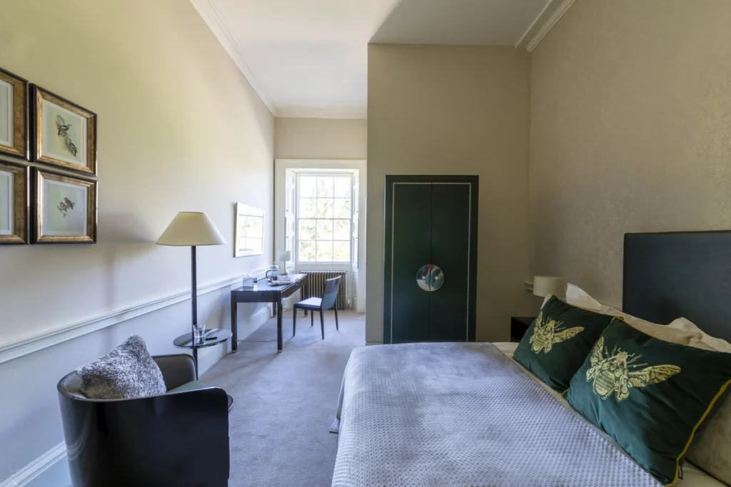 small bed with chair next to it