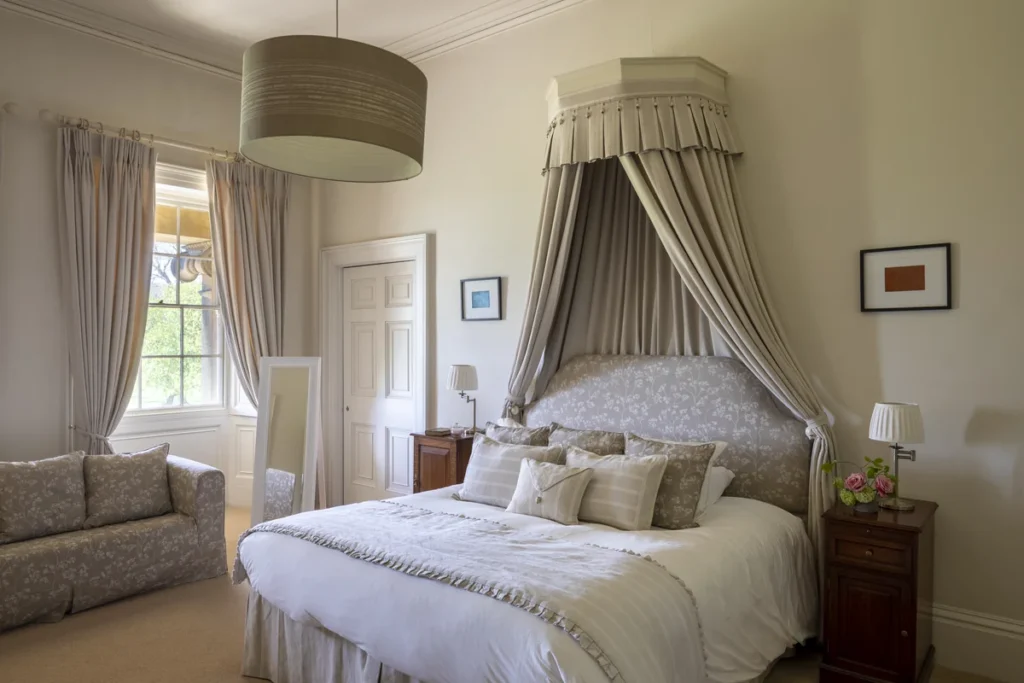 double bed with drapes over it