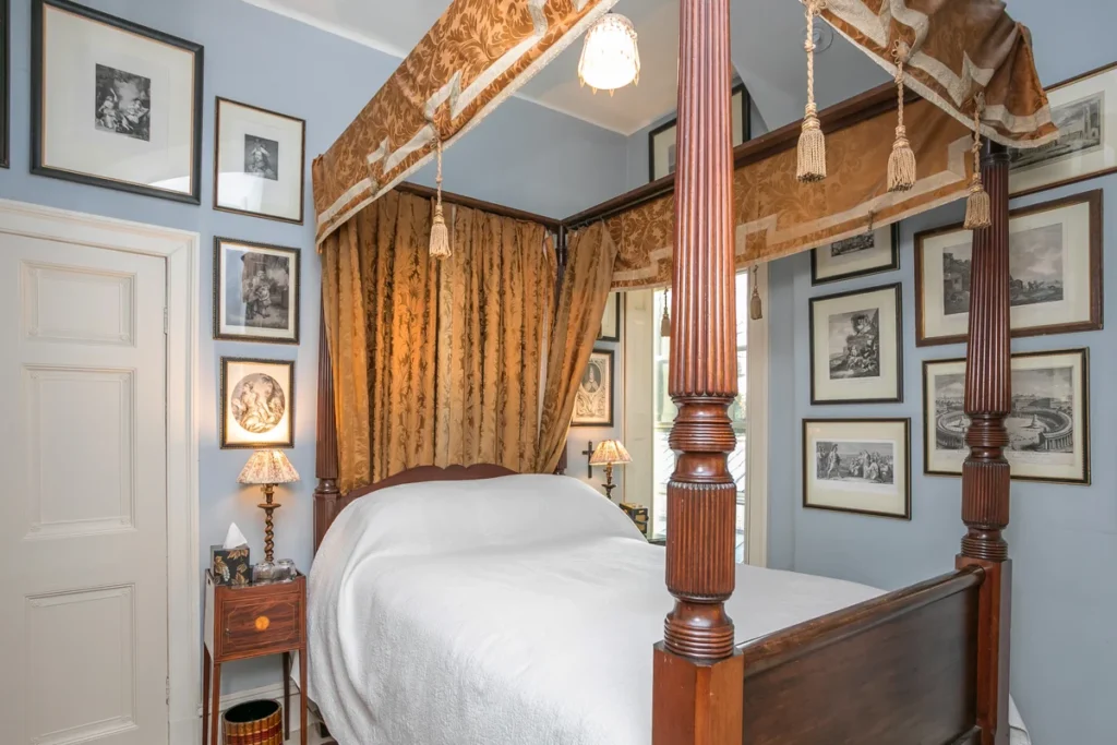 bedroom with a picture frames on wall