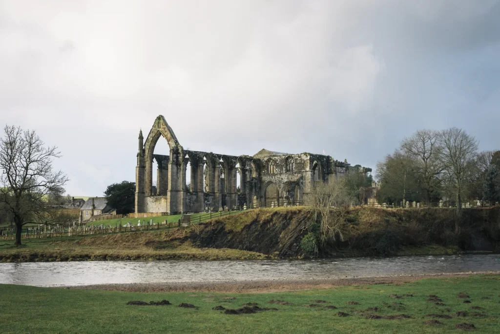 the hall at bolton abbey priory ruins from distance